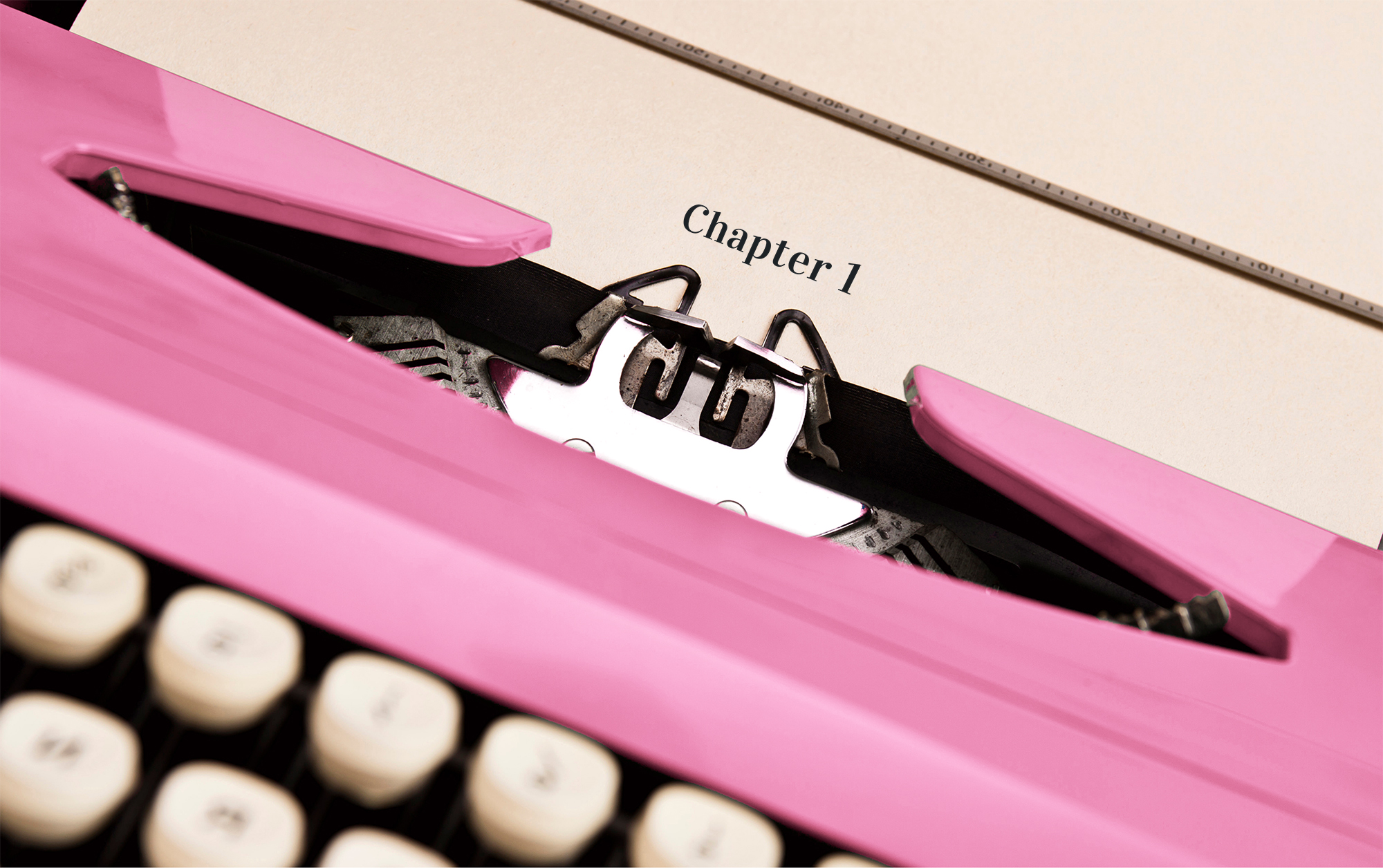 pinktypewriter A pink typewriter typing out the words, "Chapter 1"